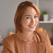 Smiling woman with light reddish-brown hair